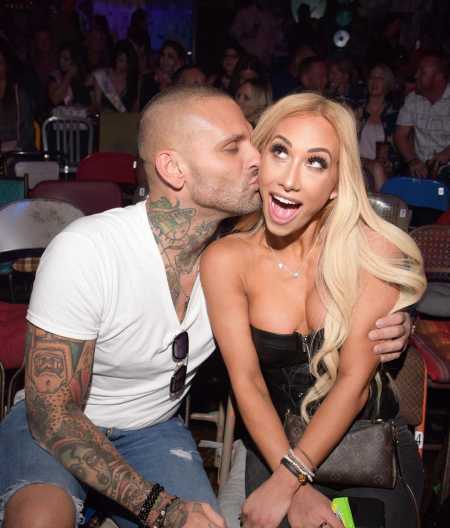 Corey Graves along with his present partner WWE star Carmella 